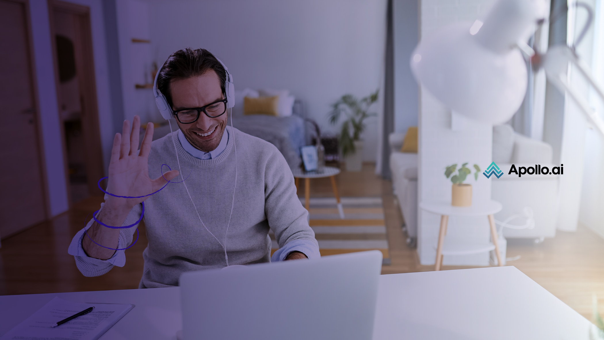 A man communicating via an online video callusing a laptop