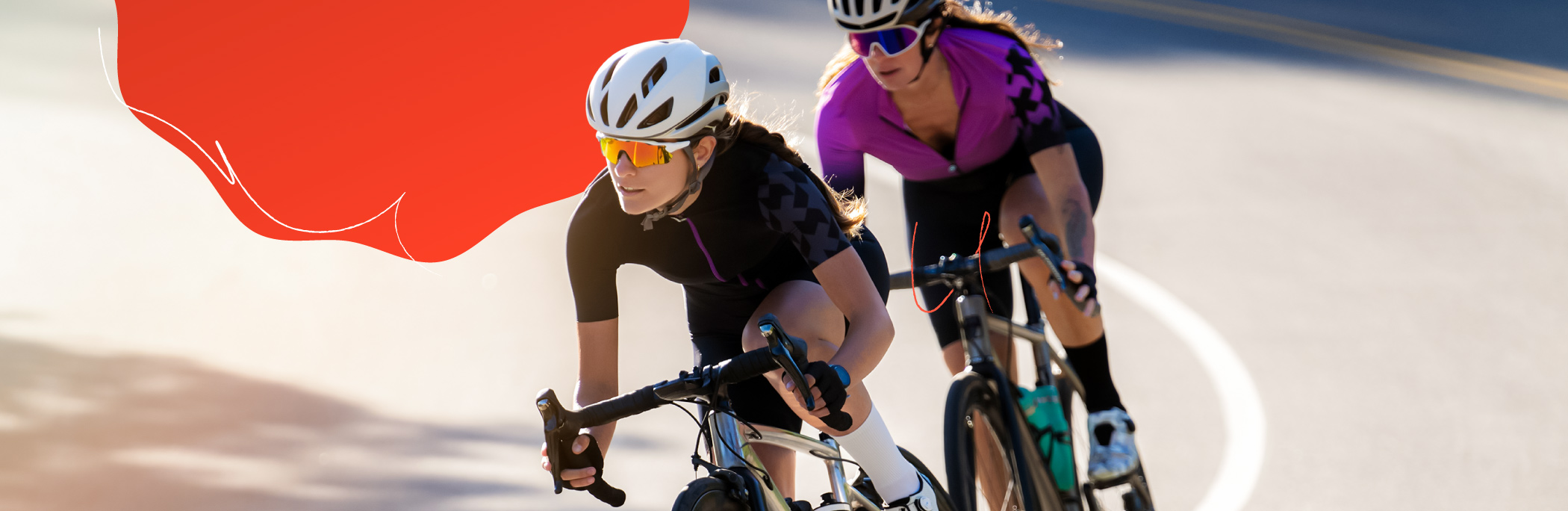 Two people riding bikes